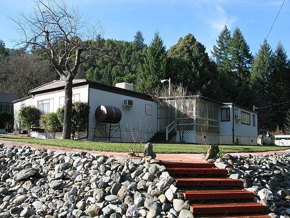 Mature landscaping with rock accent