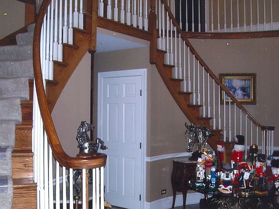 Dual stircase entry way with 8 foot chandalier and marble floors.