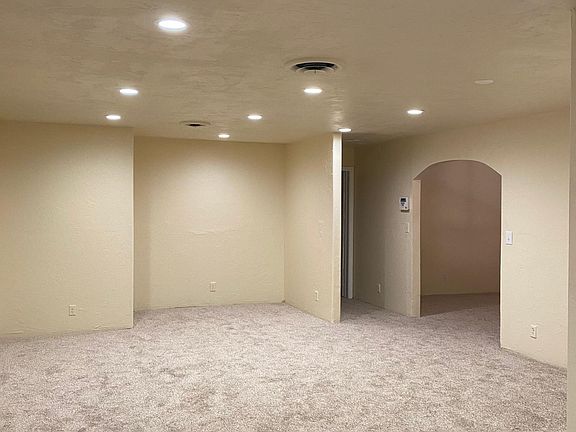 Living room view into entry and hall to bedrooms