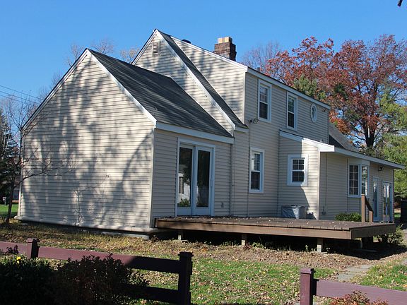 Back of home with deck