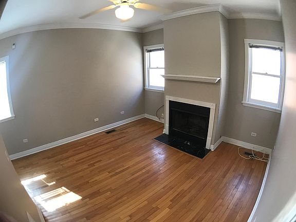 Living room with fireplace and oak floors 