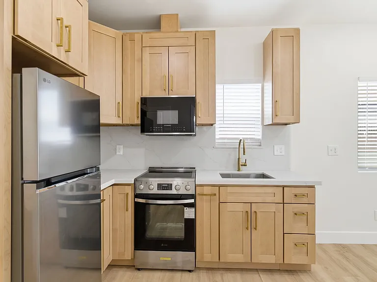 Appliances included- electric stove/ oven combo, over the range microwave, and refrigerator.