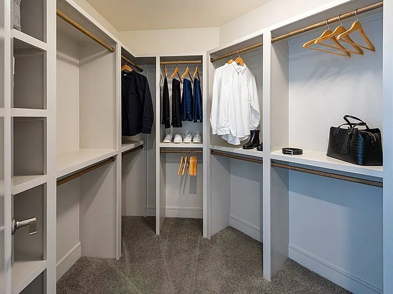 Stay effortlessly organized with a spacious walk-in closet designed for modern living.