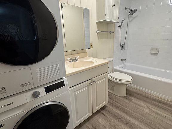 Bathroom with in-unit washer/dryer.