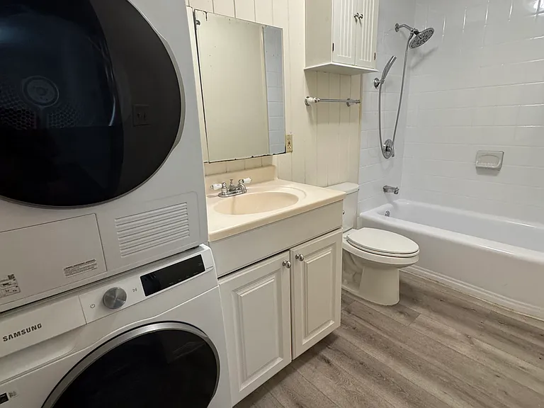 Bathroom with in-unit washer/dryer.