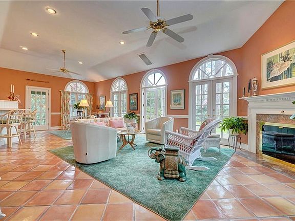 Large sunroom/family room across the back of the house