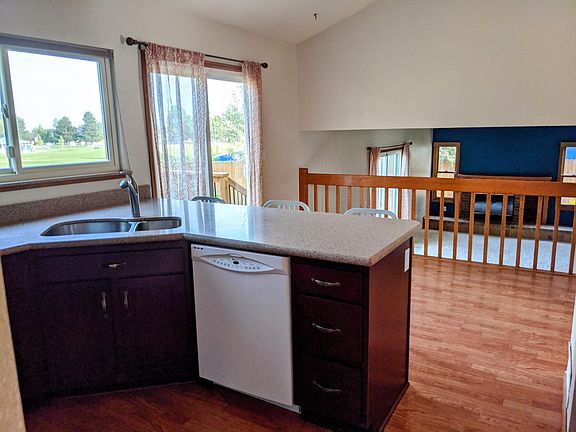 View from kitchen. Dishwasher has since been replaced with a new stainless steel model