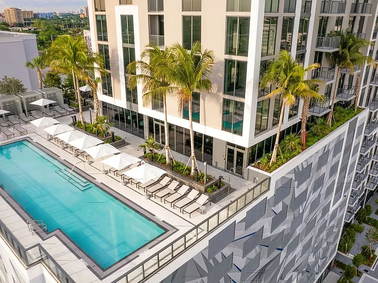 Swimming pool, sundeck, and building exterior