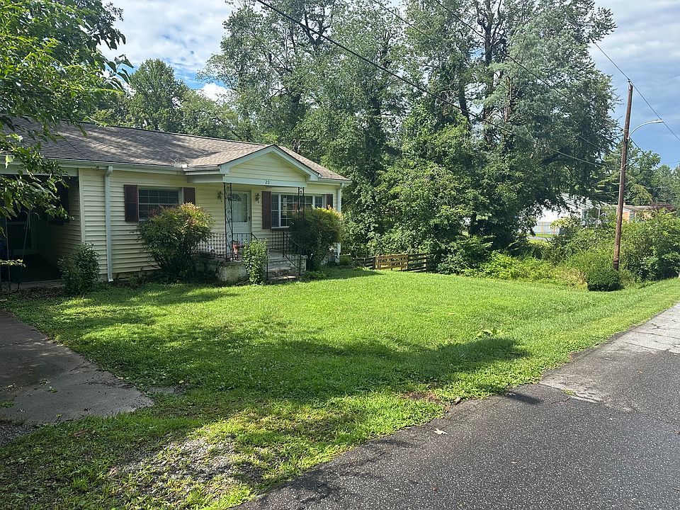 Front porch and parking for up to 3 cars in the driveway, one covered spot.
