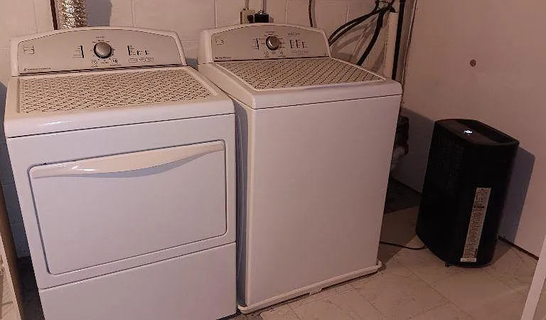 Private washer dryer in the attached basement which also provides for extra storage space