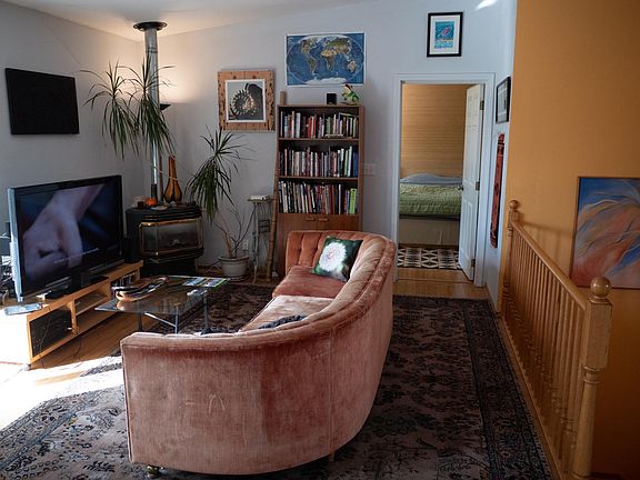 Super comfy couch and entrance to bedroom