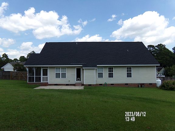 Back of the house, fenced Backyard