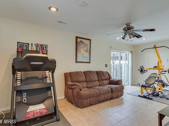 BASEMENT REC ROOM W CERAMIC TILE AND WALK OUT!