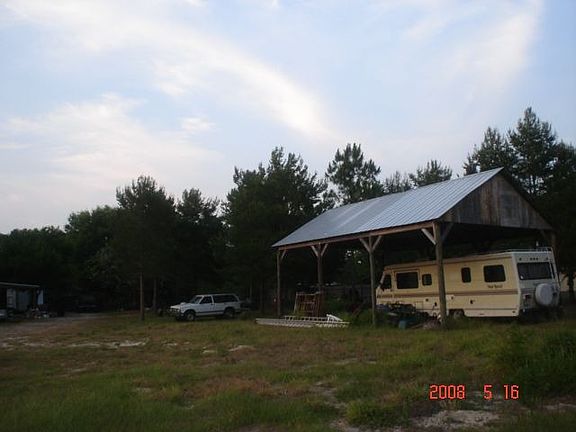 Back of Yard w/RV Pole Barn