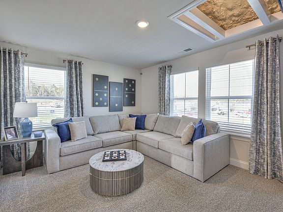 The upstairs lofts separates the secondary bedrooms from the primary suite.