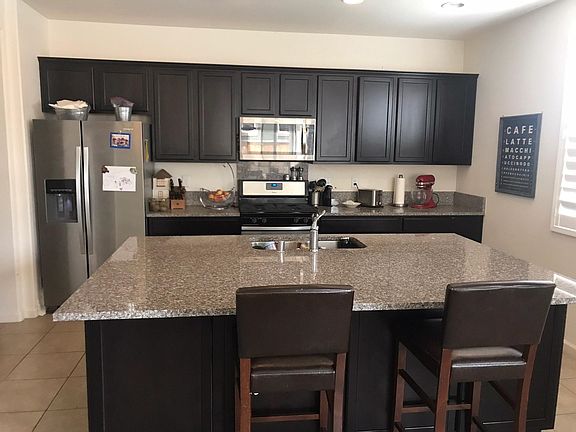 Kitchen with Island, Slab Granite and S/S