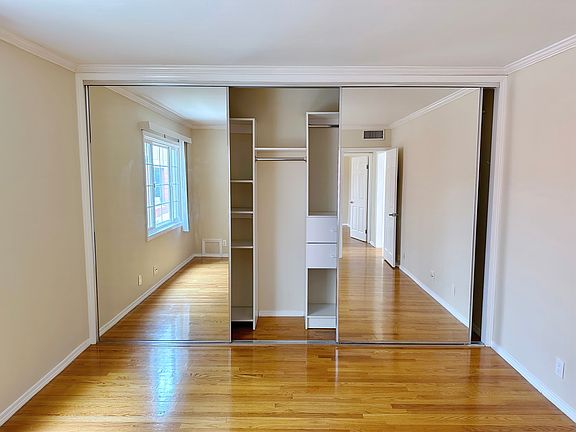 triple mirror closet with built-ins and