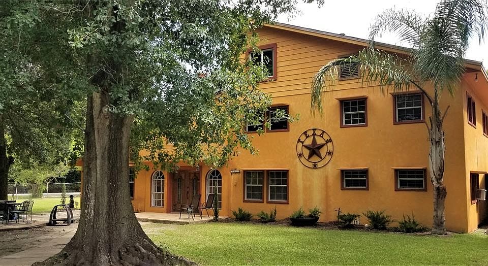 La Hacienda -- This spanish feel home is only 2 blocks from the Bay and there is so much room inside and out to grow