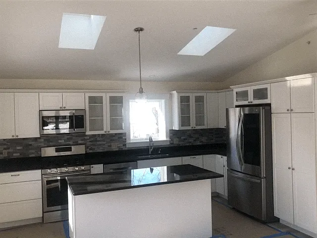 Open Floor Plan With A Beautifully Designed Kitchen For The Cooking Enthusiast! Granite Countertops, Stainless Steel Appliances. Cathedral Ceiling, Skylites, Recessed Lighting, Heating & Cooling Unit