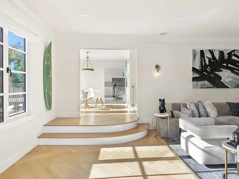 Gorgeous hardwood flooring and art work create an inspired getaway.