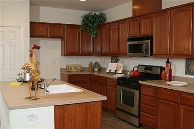 Beautiful corian counters, Stainless Steel appliances and cherrywood cabinets 