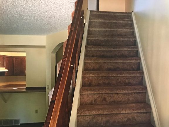 stairway to bedrooms snd full bath