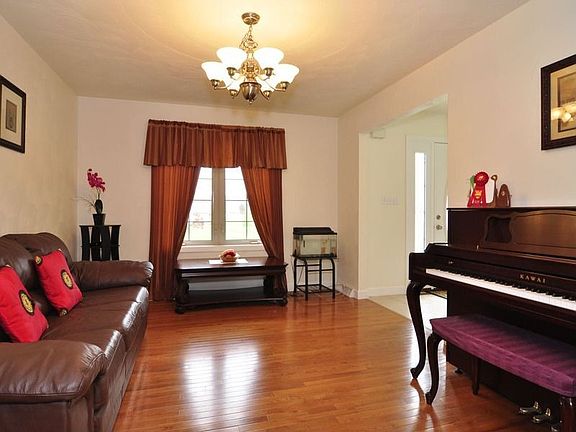 Formal living room or dining room, your choice--has lovely hardwood floors.