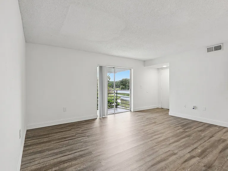 Spacious Living Area with Private Balcony Access