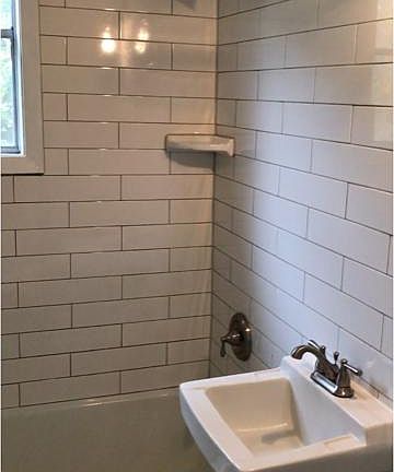 Both baths have tub/shower combos and subway tile.