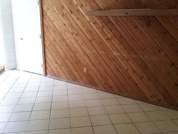 Accent wall with door to bonus room.