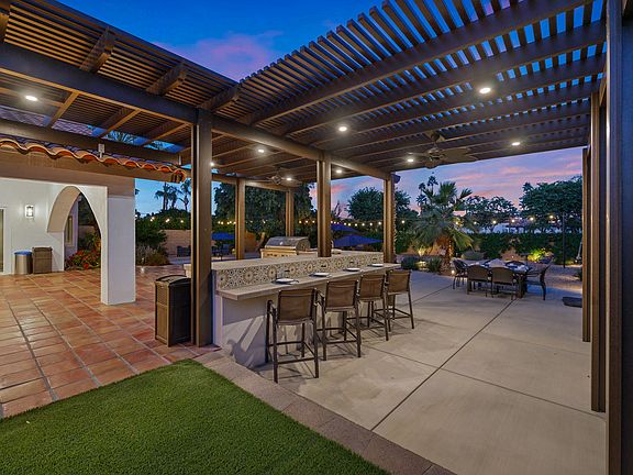 Unleash your inner mixologist and have a drink from one of the four bar-height stools.