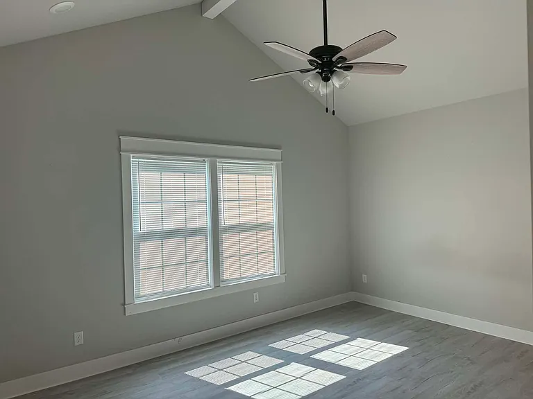 Master bedroom with vaulted ceiling