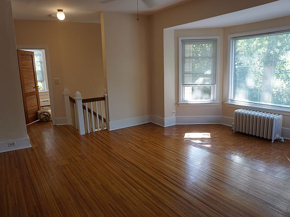living room facing front stair entrance, bedrooms at the top of the stairs