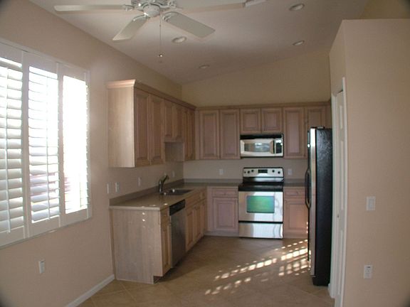 Large kitchen with stainless appliances and upgraded cabinets