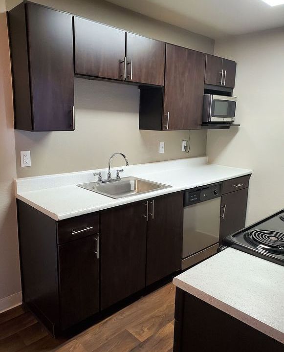 Avery Belmar - Avery Belmar - Upgraded kitchen with espresso cabinets.