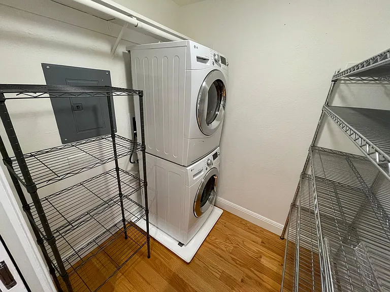 Full-size LG Washer/Dryer.
Storage for clothes and/or extra pantry items.