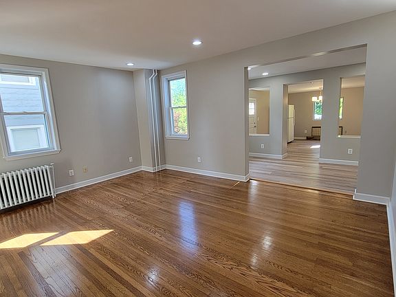 Living room, opens to kitchen. Dining room in rear.