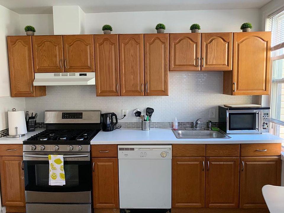 The apartment has an updated kitchen with dishwasher, fridge, freezer, microwave, and oven.