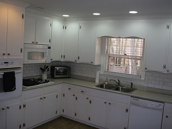 Updated kitchen with view to large, fenced yard