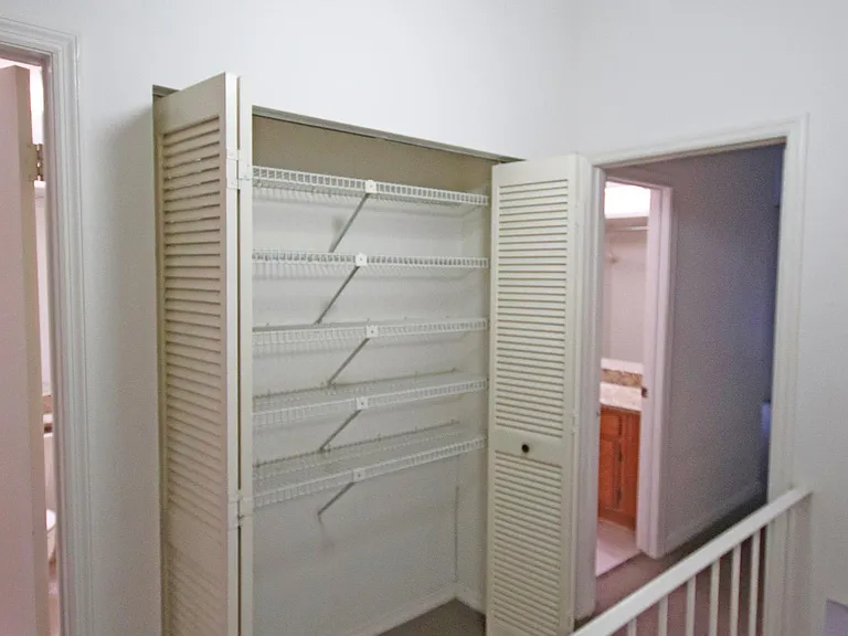 Large Hall closet with wire shelves.