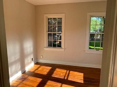Downstairs bedroom. All windows in entire home open as do additional storm windows. Cordless mini-blinds throughout home. Fresh paint throughout including white Kitchen cabinets.