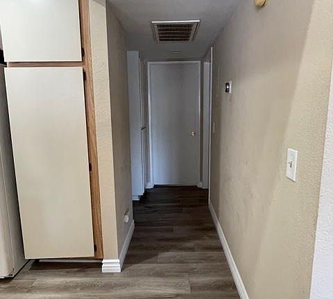 Hallway leading to master bedroom and non-master bedroom