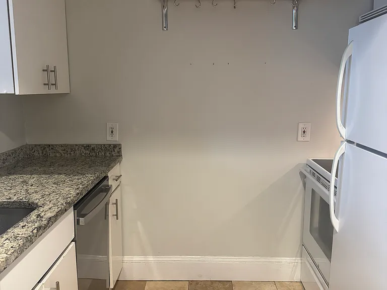 Kitchen with a brand-new stainless steel dishwasher.