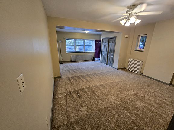 Living room towards front door entrance