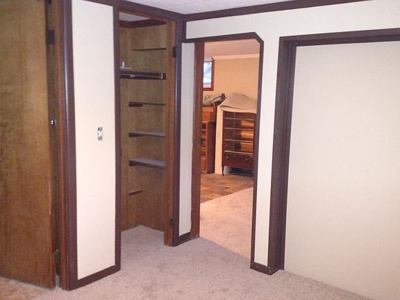 1 bed apt, bedroom closet / bath looking into living room.