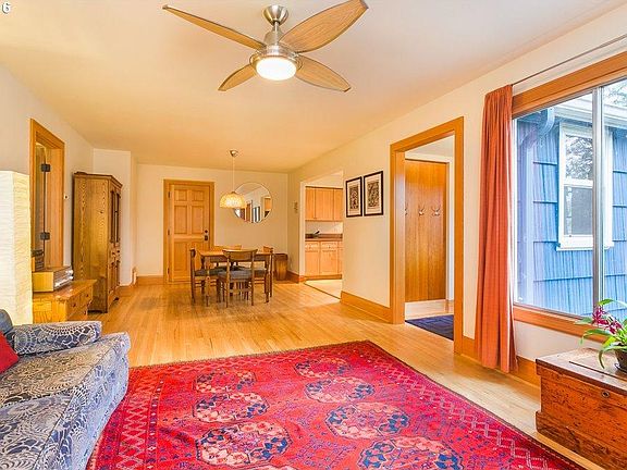 spacious, well-lit living room and dining room