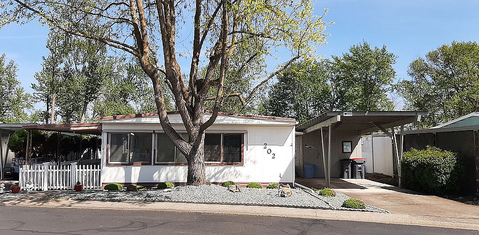 Front of home with carport