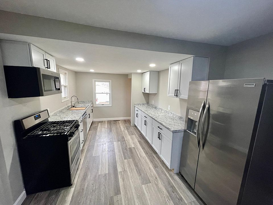 Completely updated kitchen, all new cabinets, countertops, flooring, lights, and stainless steel appliances