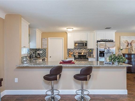 3rd image of 2401 61st Ln N