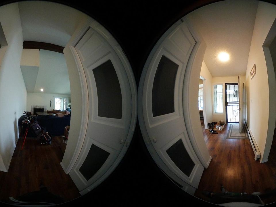 Entry foyer, with coat closet, leading to living room.  Addi